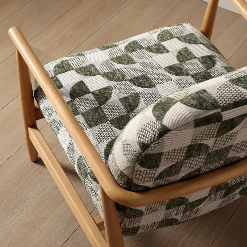 Chair with a patterned cushion on a wooden floor