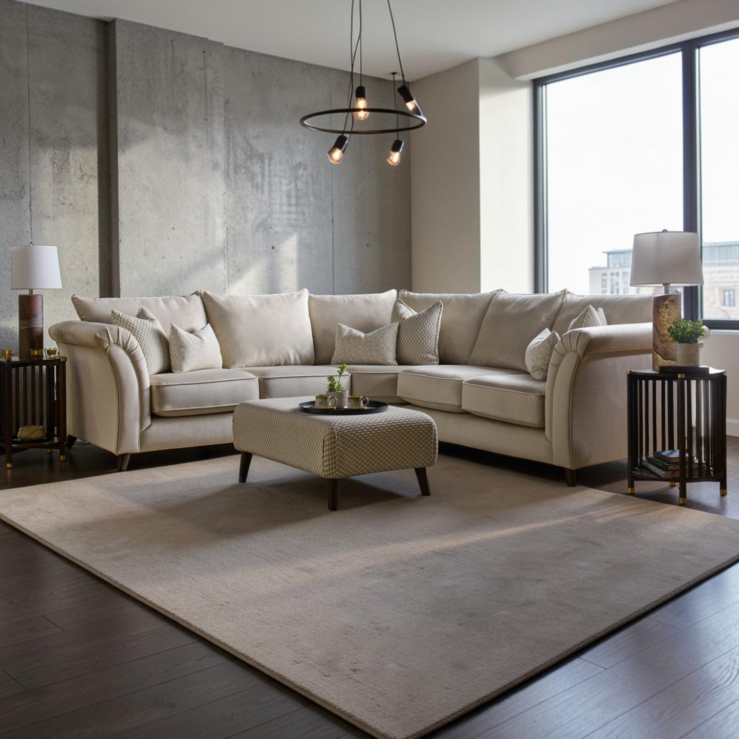 Buoyant Belluci corner sofa in a neutral fabric with scatter cushions and matching footstool in a contemporary living room.