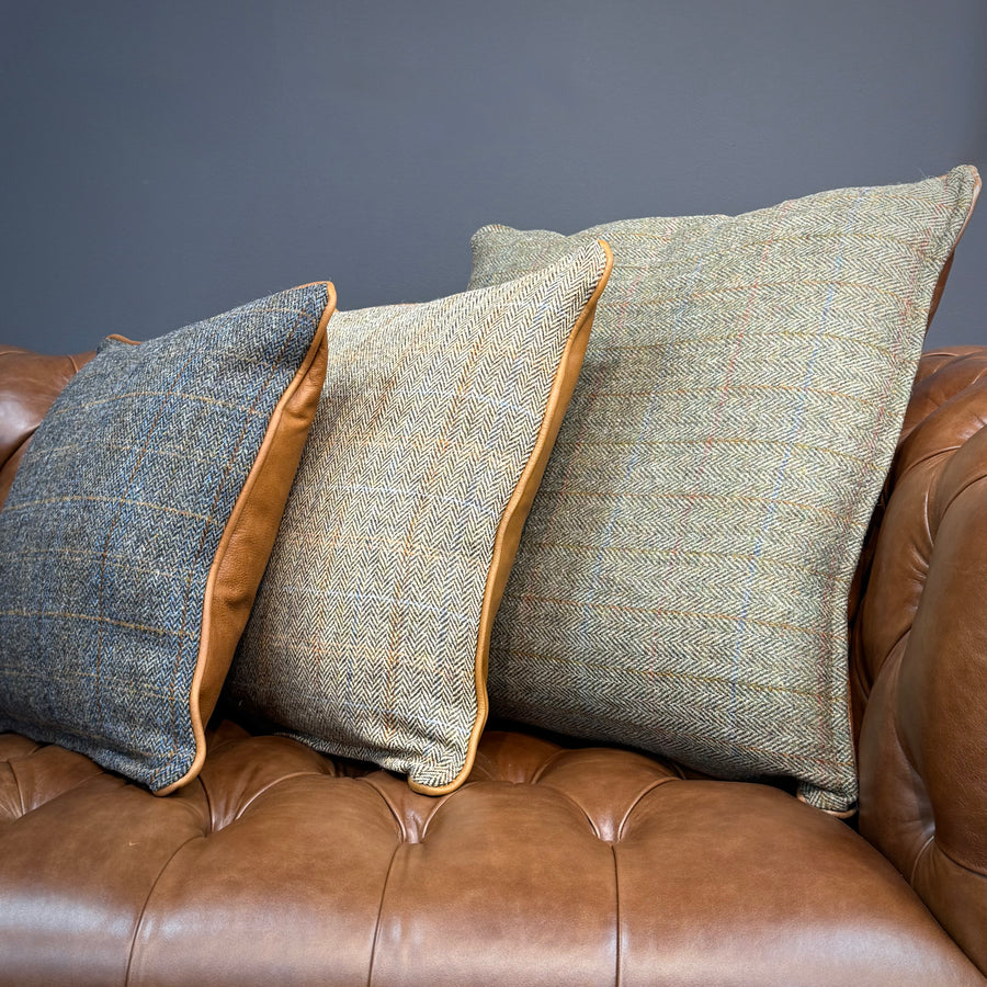 Complimentary Harris Tweed and leather scatter cushions