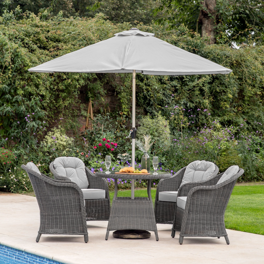 2 x 3m grey rectangular garden parasol providing shade over an outdoor dining set