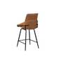 A modern counter height bar stool with a brown upholstered seat and backrest, supported by a slim black metal frame with four legs.