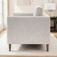 Henley sofa in Natural fabric showing the slim tapered arm, upholstered side and wooden legs