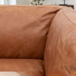 Close-up of Hampton sofa back cushion showing the texture and character of the mellow brown leather