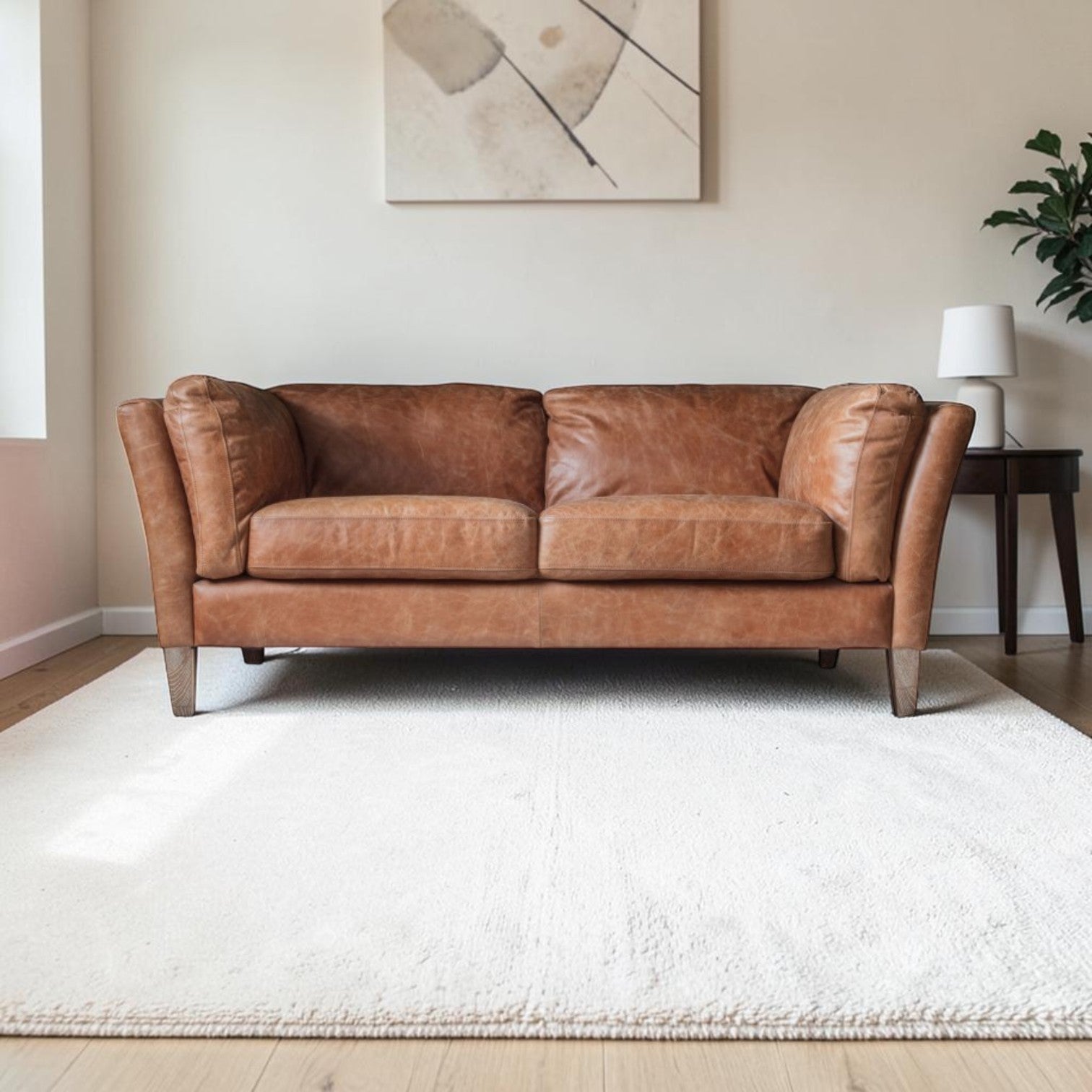 Hampton 2 Seater Sofa in mellow brown top-grain leather with padded arms and solid ash legs