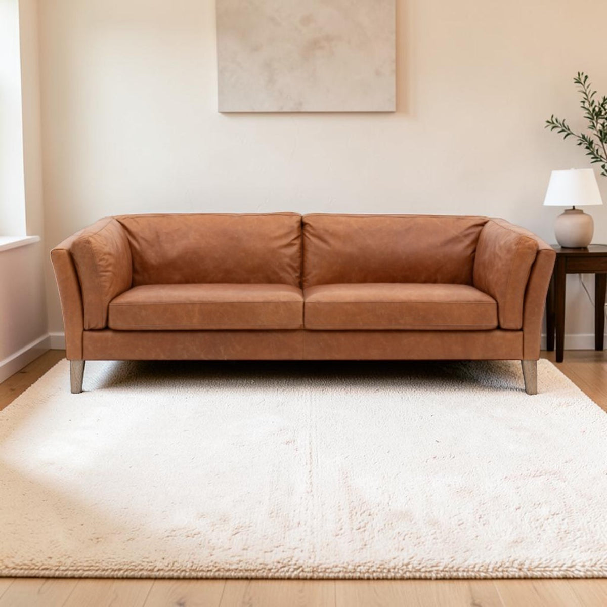 Hampton 3 Seater Sofa in mellow brown top-grain leather with padded arms and solid ash legs