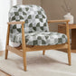 Walter Scandinavian accent chair with light wood spindle frame and green geometric jacquard upholstery