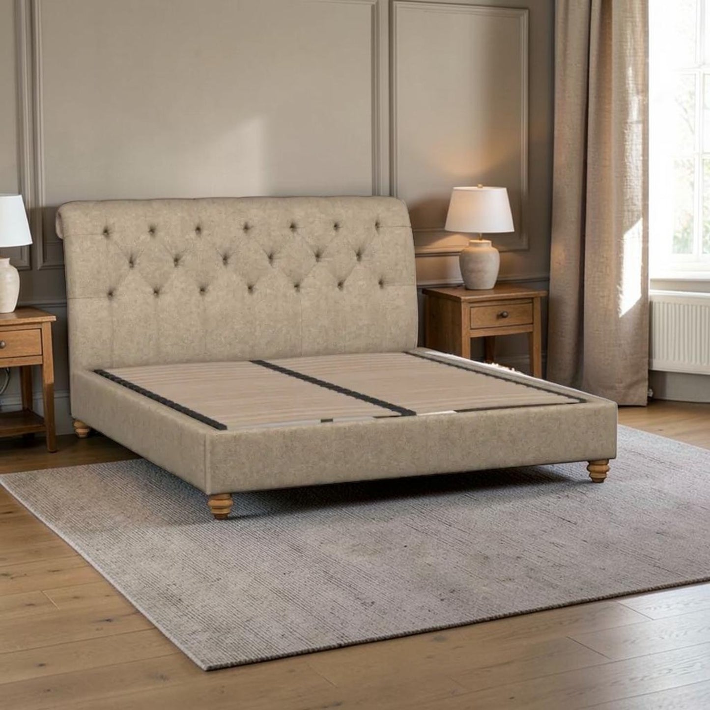 A beige upholstered bed frame with a tall tufted headboard and wooden legs, shown in a styled bedroom setting with wooden nightstands, lamps, a window, and a gray rug.